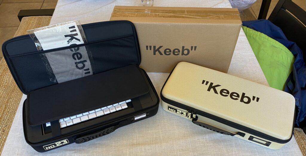 Keyboard cases with "No.23 Keeb" branding.